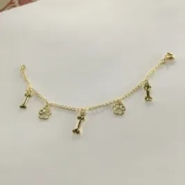 PULSEIRA INFANTIL  PATINHA DE CACHORRO DOURADA