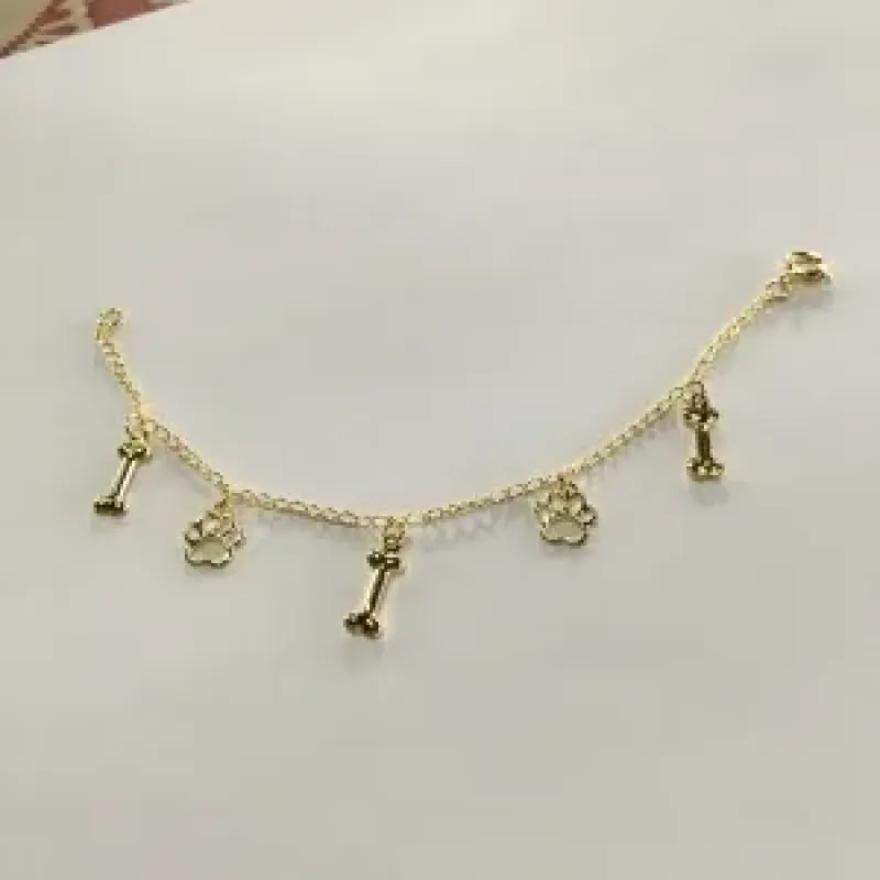 PULSEIRA INFANTIL  PATINHA DE CACHORRO DOURADA
