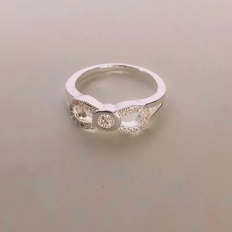 ANEL LAÇO VAZADO MICROZIRCÒNIA BANHO DE PRATA