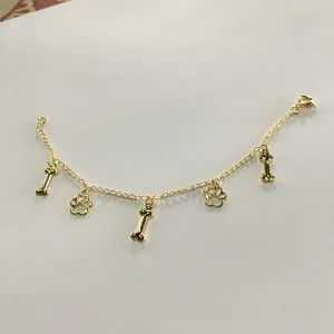 PULSEIRA INFANTIL  PATINHA DE CACHORRO DOURADA